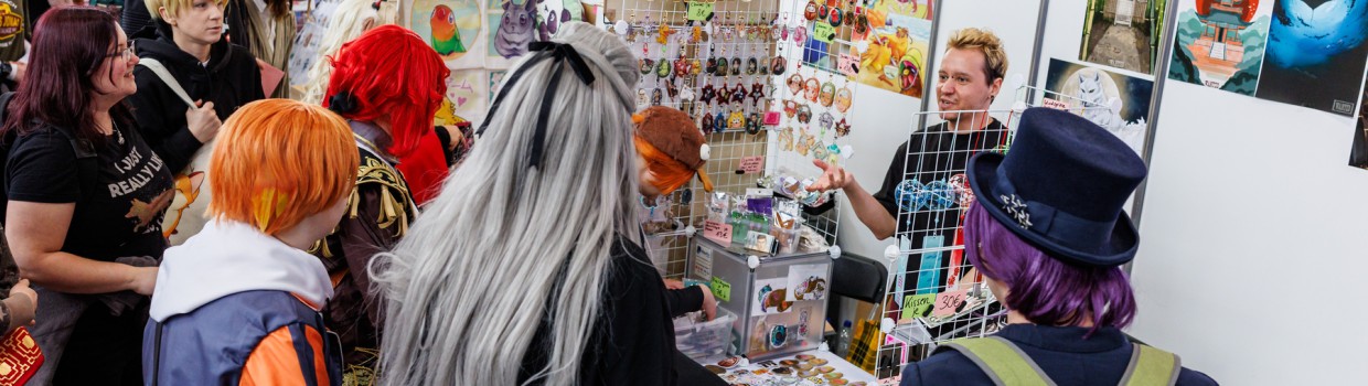Artist booth with visitors in the New Artist Alley at Manga-Comic-Con 2025